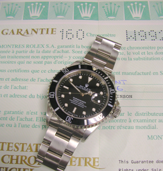 1996 steel Date Submariner 16610 with boxes & papers. Avoid the waiting lists fo