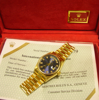 18ct Day-Date with a stunning blue / diamond dot dial custom-made ( not by Rolex