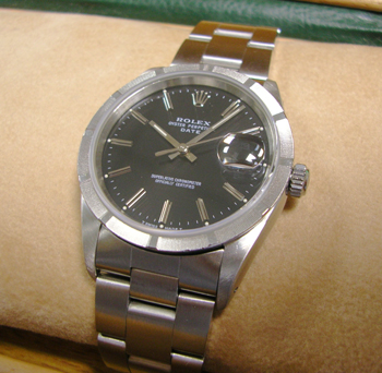 Very smart Oyster Perpetual Date model 15210 with black / baton dial and Oyster
