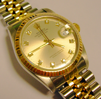 Midi bicolour Datejust with a very nice custom-made ( not by Rolex ) DIAMOND dot
