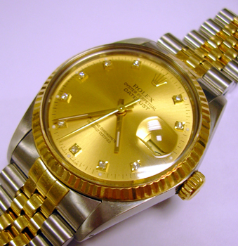 Bicolour Datejust with champagne / DIAMOND dot dial. This is the plastic glass m