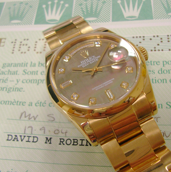 Latest Day-Date model 118205 in <b>rose gold with black Mother-of-Pearl / diamon