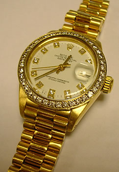 18ct Datejust, serviced February 2005. Diamond bezel custom made, NOT by Rolex. 