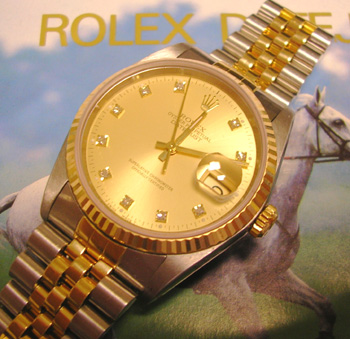 Bicolour Datejust, champagne diamond dial, box & manual. Price reflects very sli