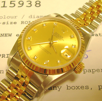 Bicolour mid-size Datejust with champagne / diamond dot dial