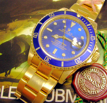 18ct gold Submariner model 16808 with blue dial and bezel, boxed with manual. Se