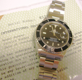 c2002 Date Submariner, latest model 16610 with solid end bracelet and luminova d