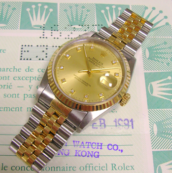 Bicolour Datejust, diamond dot / champagne dial, original papers. One of the mos