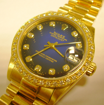 18ct mid-size Datejust which has had a popular blue diamond dot dial and diamond