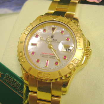 18ct lady's Yachtmaster with ORIGINAL Mother-of-Pearl & Ruby dial, boxes & manua