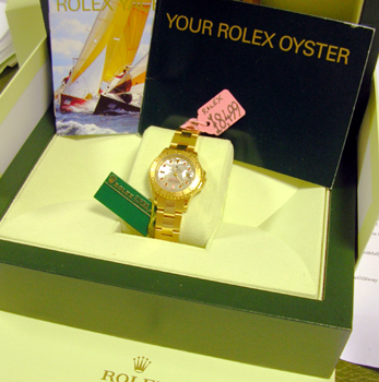 18ct lady's Yachtmaster with ORIGINAL Mother-of-Pearl & Ruby dial, boxes & manua