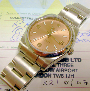 Stainless steel Air-King model 114200 with salmon pink / 3-6-9 dial and Oyster 7